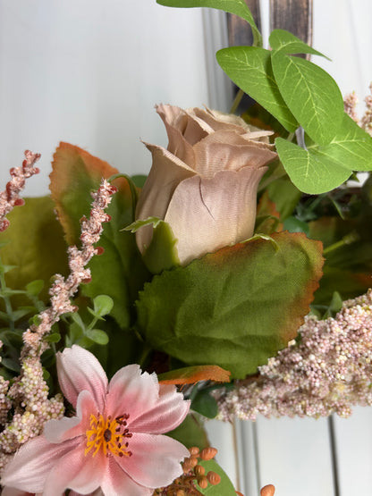 Spring peony and rose wreath featuring soft pink flowers and green leaves on an 18-inch grapevine base.